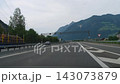 Mountain road driving through cloudy landscape 143073879