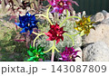 children wind up toy with colorful propellers that spin in wind 143087809