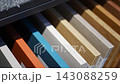 Wood finish samples in different shades displayed in furniture showroom. Material selection represents furniture design, renovation and interior planning 143088259