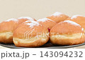 Video of Berliners (German donuts) with raspberry jam and powdered sugar 143094232