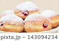 Video of Berliners (German donuts) with raspberry jam and powdered sugar 143094234