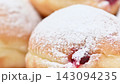 Video of Berliners (German donuts) with raspberry jam and powdered sugar 143094235