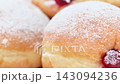 Video of Berliners (German donuts) with raspberry jam and powdered sugar 143094236