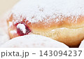 Video of Berliners (German donuts) with raspberry jam and powdered sugar 143094237