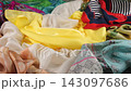 Luxury silk fabric folds elegantly in a smooth slow motion movement. Premium textile material showcasing vibrant colors is perfect for fashion industry concepts.  143097686