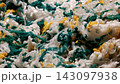 Close up of tightly packed fiber waste inside processing cell at recycling plant 143097938