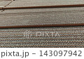 Horizontal layers of brown corrugated cardboard sheets background 143097942
