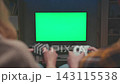 Player Playing Video Game at Green Screen. Closeup of Male Fingers Pressing Buttons on White Game Controller. Unrecognizable People Plays Electronic Match facing Mockup Chroma Key Tech for Gaming 4k 143115538