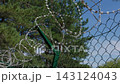 Razor Wire Barbed Fence Protecting Restricted Area Outdoors 143124043