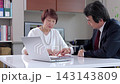 Senior men and women holding a meeting in the office 143143809