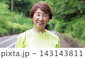 Senior woman smiling in sportswear 143143811