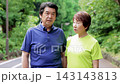 A senior couple going for a walk 143143813