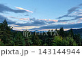 Timelapse Of Clouds Moving Over Pine Forest And Mountains At Sunset, zoom in 143144944