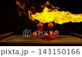 Tomatoes in fire. Vegetables throwing falling through fire 143150166