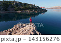 Woman Resting After Outdoor Workout by the Sea 143156276