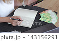 Woman managing home budget with cash 143156291