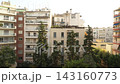 4K aerial drone video above between houses pines city sea in summer at dawn Thessaloniki in Greece 143160773