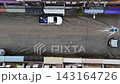 4K Aerial top-down view of vehicles driving through flooded urban street 143164726