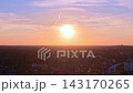 Cityscape at Solar Eclipse golden hour, setting sun. Nice aerial view drone 143170265