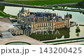Aerial view of the magnificent French Castle de Chantilly and its picturesque park at sunset near Paris, France 143200425