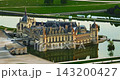 Aerial view of the magnificent French Castle de Chantilly and its picturesque park at sunset near Paris, France 143200427