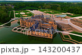 Aerial view of the magnificent French Castle de Chantilly and its picturesque park at sunset near Paris, France 143200437