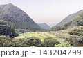 [Yamaga City, Kumamoto Prefecture] Spider lilies blooming in the terraced rice fields of Bansho and the rural scenery of early autumn. 143204299