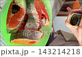 Cooking salmon in the kitchen with simple ingredients and easy steps 143214218