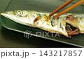 A scene at the dinner table where people are enjoying grilled saury – a way of eating that cherishes Japanese food culture and food. 143217857