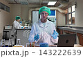 Laboratory room. Female scientists conducting laboratory research with colorful chemical samples. Using test tubes flasks and microscopes for scientific analysis and experimentation. Bio or chemical. 143222639