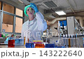 Laboratory room. Female scientists conducting laboratory research with colorful chemical samples. Using test tubes flasks and microscopes for scientific analysis and experimentation. Bio or chemical. 143222640