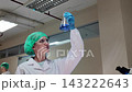 Laboratory room. Female scientists conducting laboratory research with colorful chemical samples. Using test tubes flasks and microscopes for scientific analysis and experimentation. Bio or chemical. 143222643