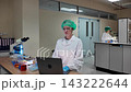 Laboratory room. Female scientists conducting laboratory research with colorful chemical samples. Using test tubes flasks and microscopes for scientific analysis and experimentation. Bio or chemical. 143222644