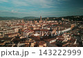 Detailed drone panorama of central Florence with Palazzo Vecchio, Basilica Santa Croce, medieval rooftops and Tuscan hills. 143222999
