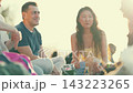 Diverse friends enjoying a sunny picnic together 143223265