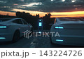 Modern Electric Cars Recharging Outdoors in Futuristic Twilight Environment 143224726