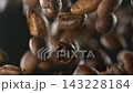 Coffee beans falling through the air in super slow motion black background 143228184