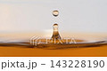 Black tea droplet hits the tea surface with splash and ripples in super slow motion 143228190