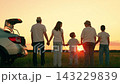 Happy family road trip with kids, enjoying nature, sunset, sky. Parents mom dad, kids sons, car trip, family vacation. Mom dad, children travel car, picnic outdoors. Parents children, enjoying nature 143229839