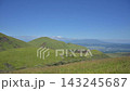 The landscape of Aso with white volcanic smoke rising from a grassy field of pampas grass in early autumn. 143245687