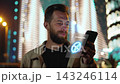 Caucasian Man Scanning Face with Smartphone Interface for Identity Verification. One Male User Unlocking Mobile Device using Biometric Security System with 3d Holographic Facial Scanner Technology 4k 143246114