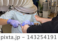 Toenail Fungus Treatment Concept with Professional Pedicure Specialist Using Electric Drill for Careful Nail Cleaning and Foot Care 143254191