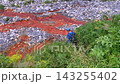 Male hiker descending rear view toward a mineral spring in Svaneti, Georgia, showing backcountry water collection, trekking logistics, natural hydration sources, and mountain route self-sufficiency 143255402