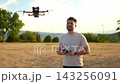 Joyful moments while flying a drone in the golden sunset sky 143256091