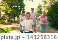 Children play in city park, friends run paths together. Happy boy, girl run, play together in outdoor. Happy childhood dream. Kids friends weekend. Kids boy girl, healthy lifestyle. Family holidays 143258316