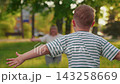 Loving mother hugs little boy. Family holiday. Happy child son hugs mom in summer park. Carefree childhood in mother arms. Family, mom child. Kid happily playing outdoors with parents. Mother Day 143258669