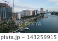 Aerial drift past a construction crane over the miami beach intracoastal waterway 143259915