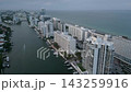 Aerial cruise along a misty miami beach intracoastal skyline 143259916