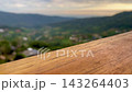 Sunrise in the mountains and wooden table 143264403