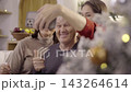 Happy family taking selfie with smartphone during christmas time 143264614